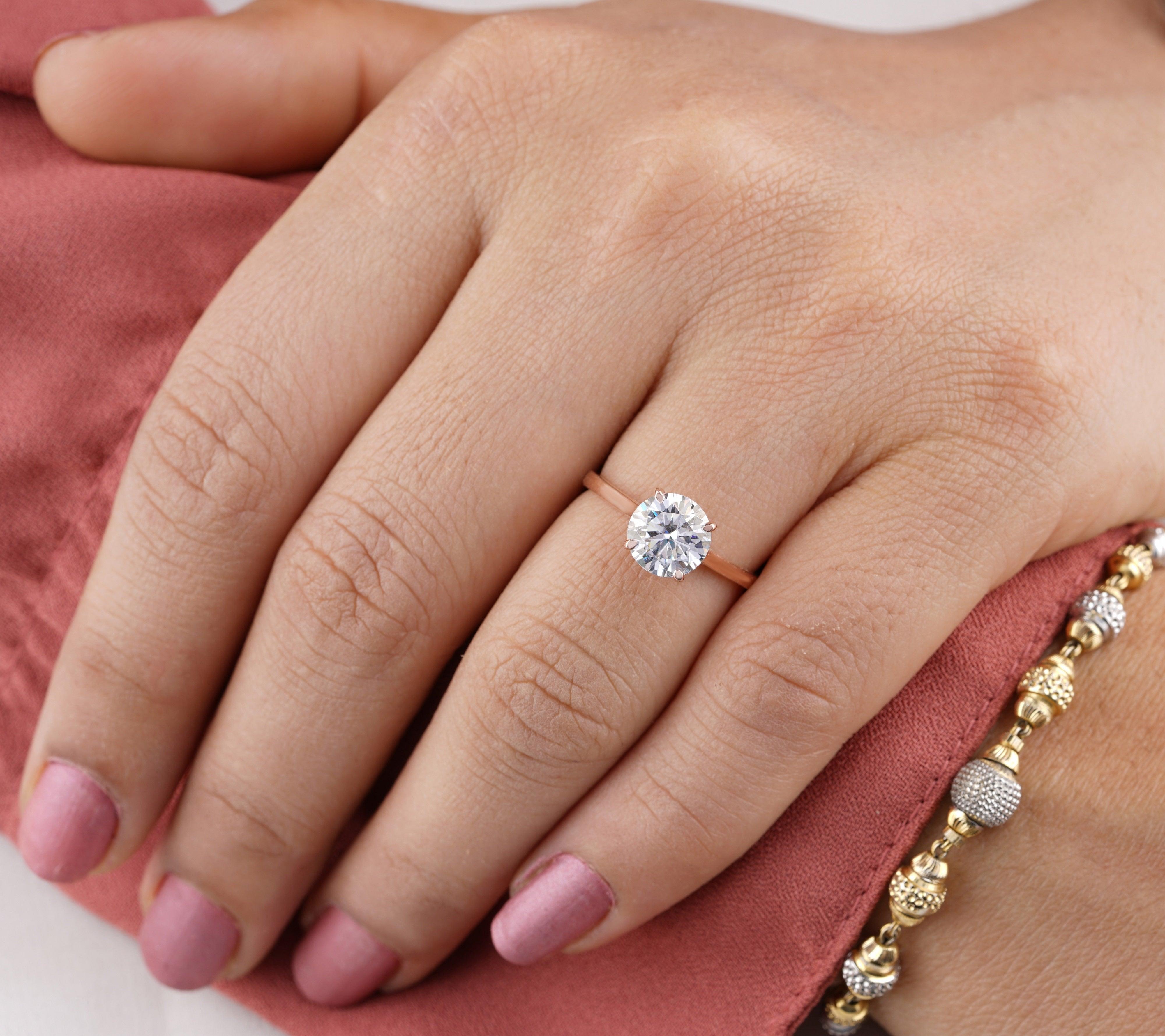 18k Round Cut Halo Moissanite Infinity Engagement Ring from Black Diamonds  New York